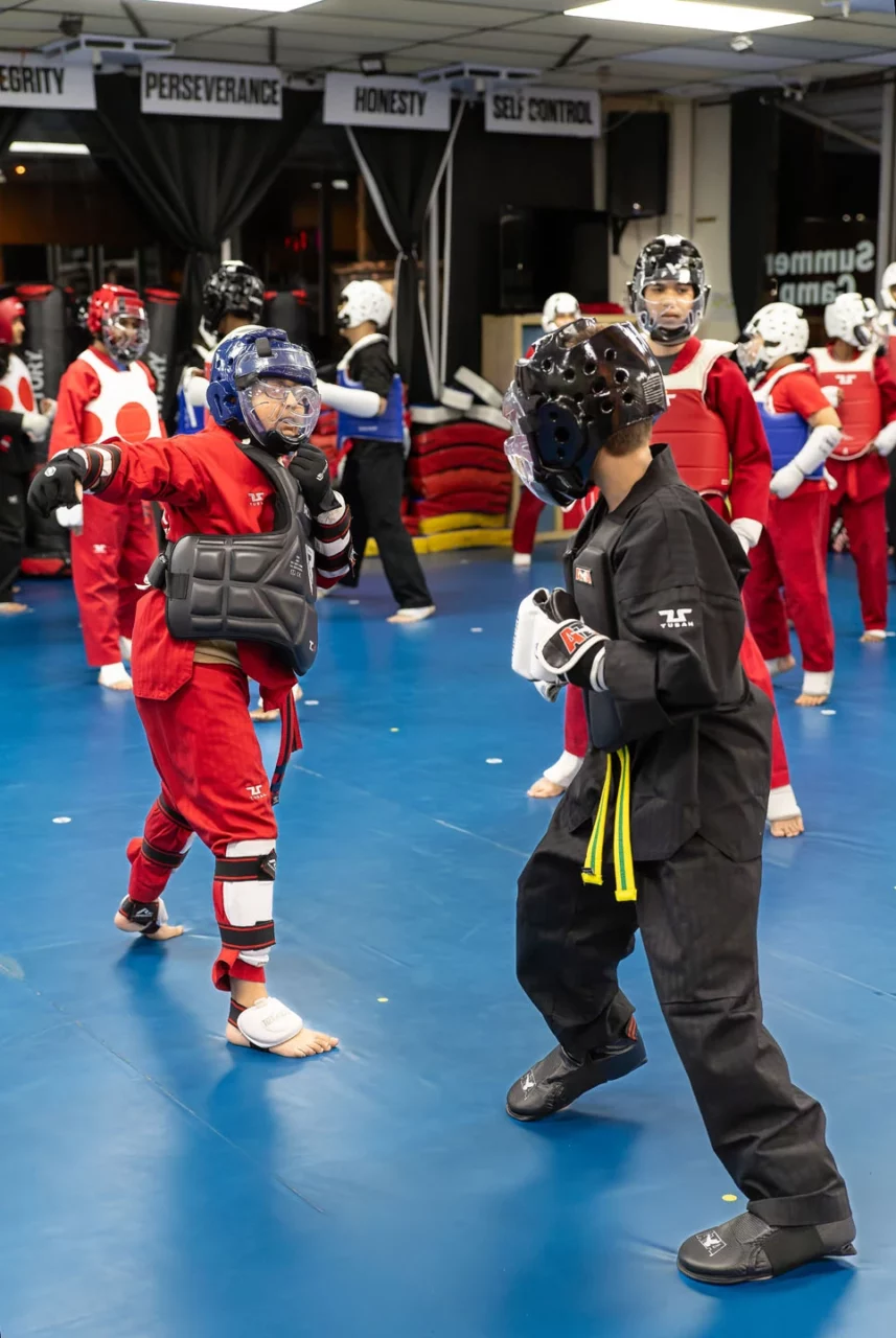 two taekwondo students sparring